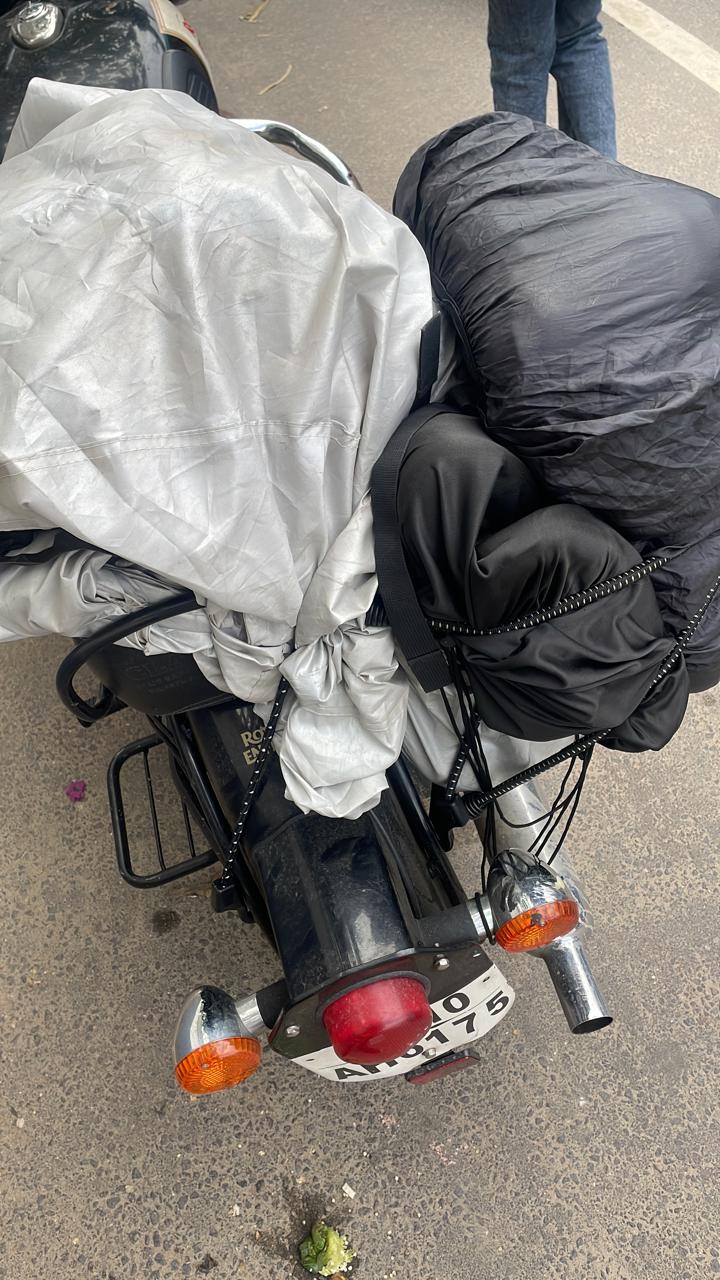 Image of luggage falling to one side of a bike